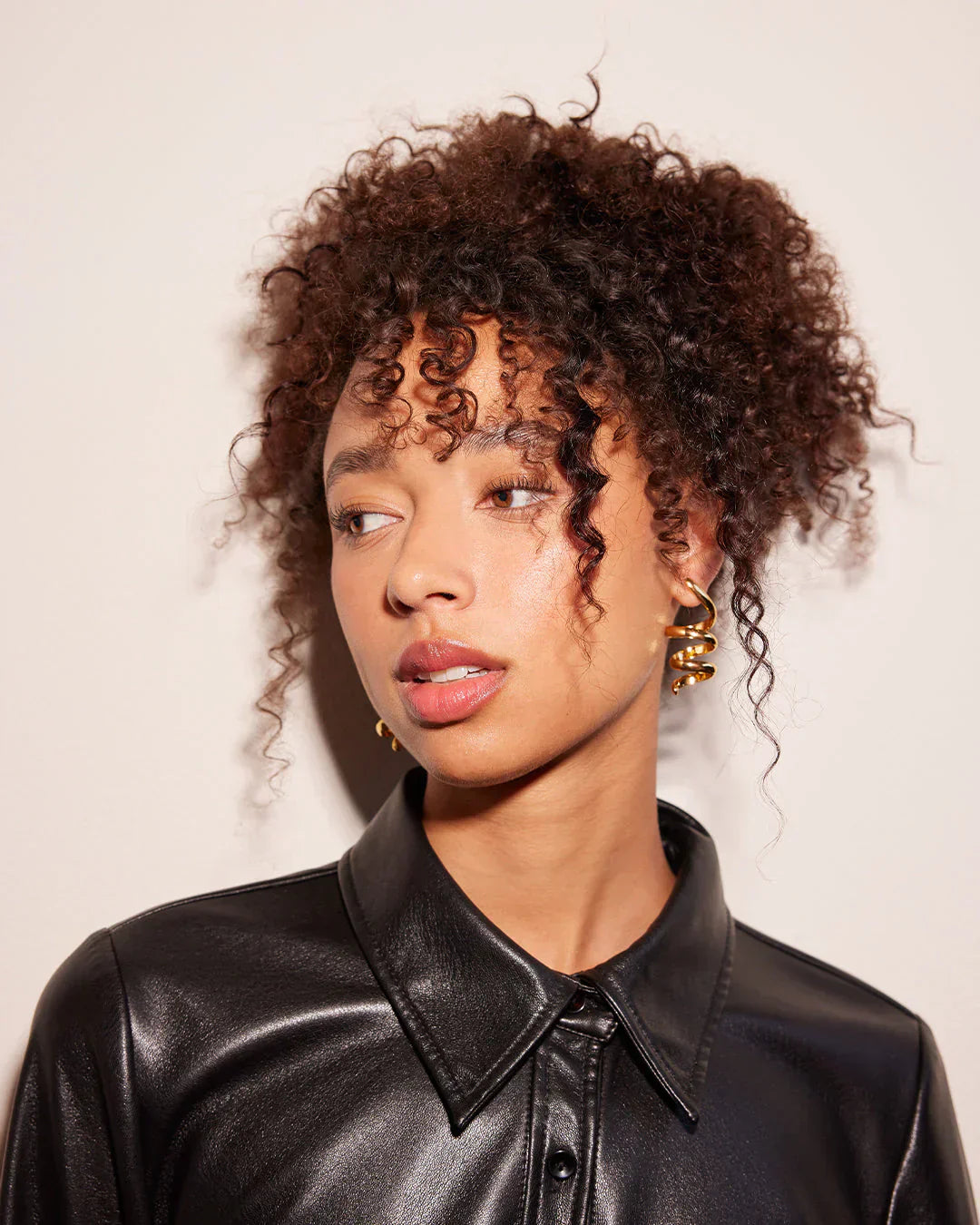 Model headshot with curly hair